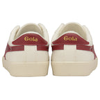 Rear view of a pair of Gola women's low-top sneakers in off-white with two red stripes.