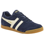 Three-quarter view of a Gola Harrier suede trainer in navy with white stripes and a gum sole.