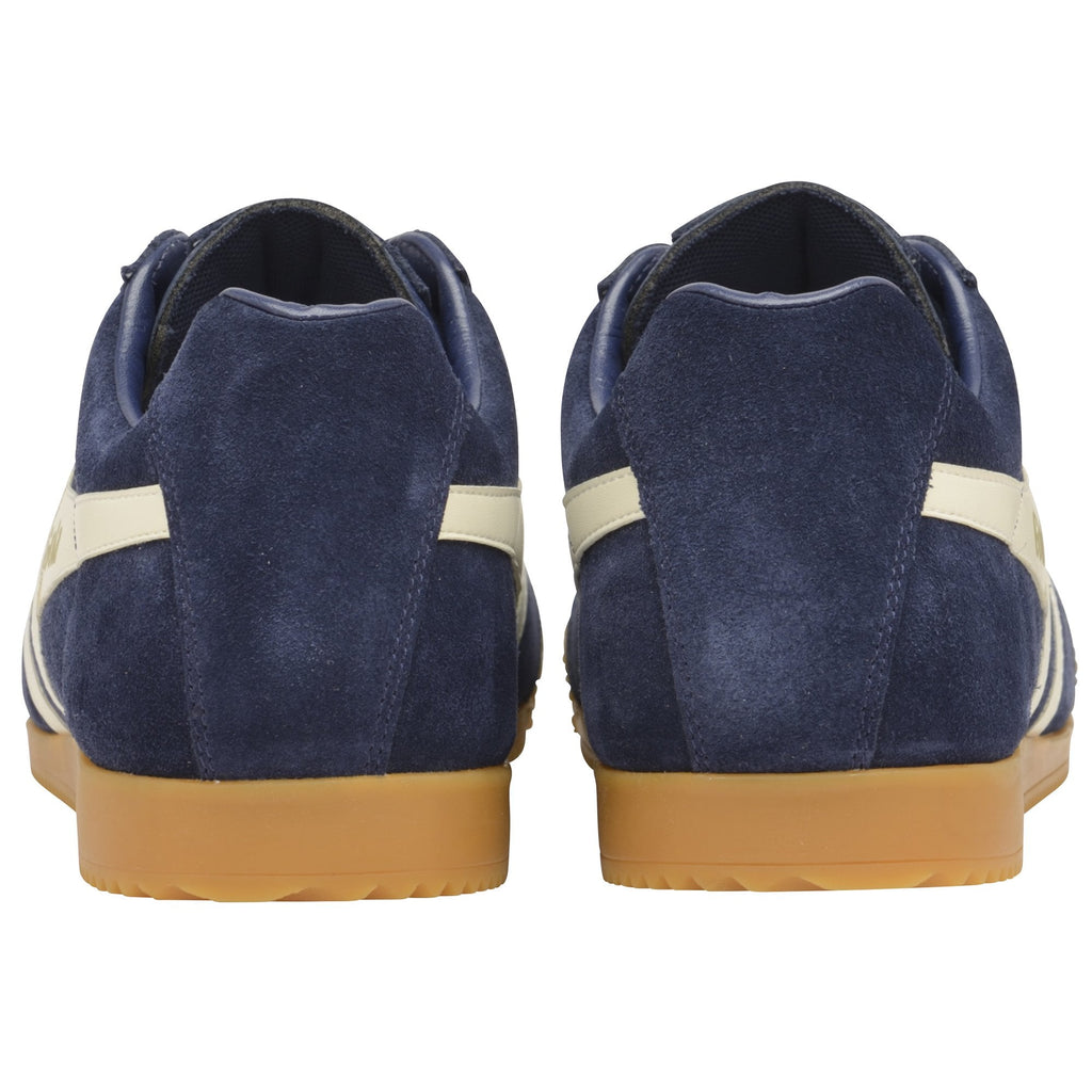 Rear view of a pair of Gola Harrier suede trainers in navy with white stripes and gum soles.