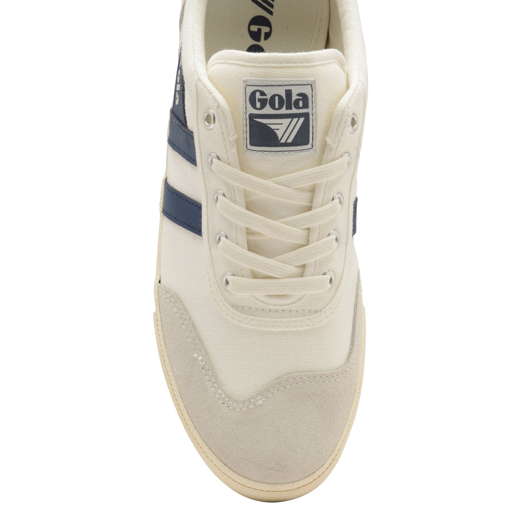 The front view of a white Gola sneaker with blue stripes and white laces.