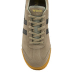 The top-down view of a single tan suede Gola sneaker with black stripes.