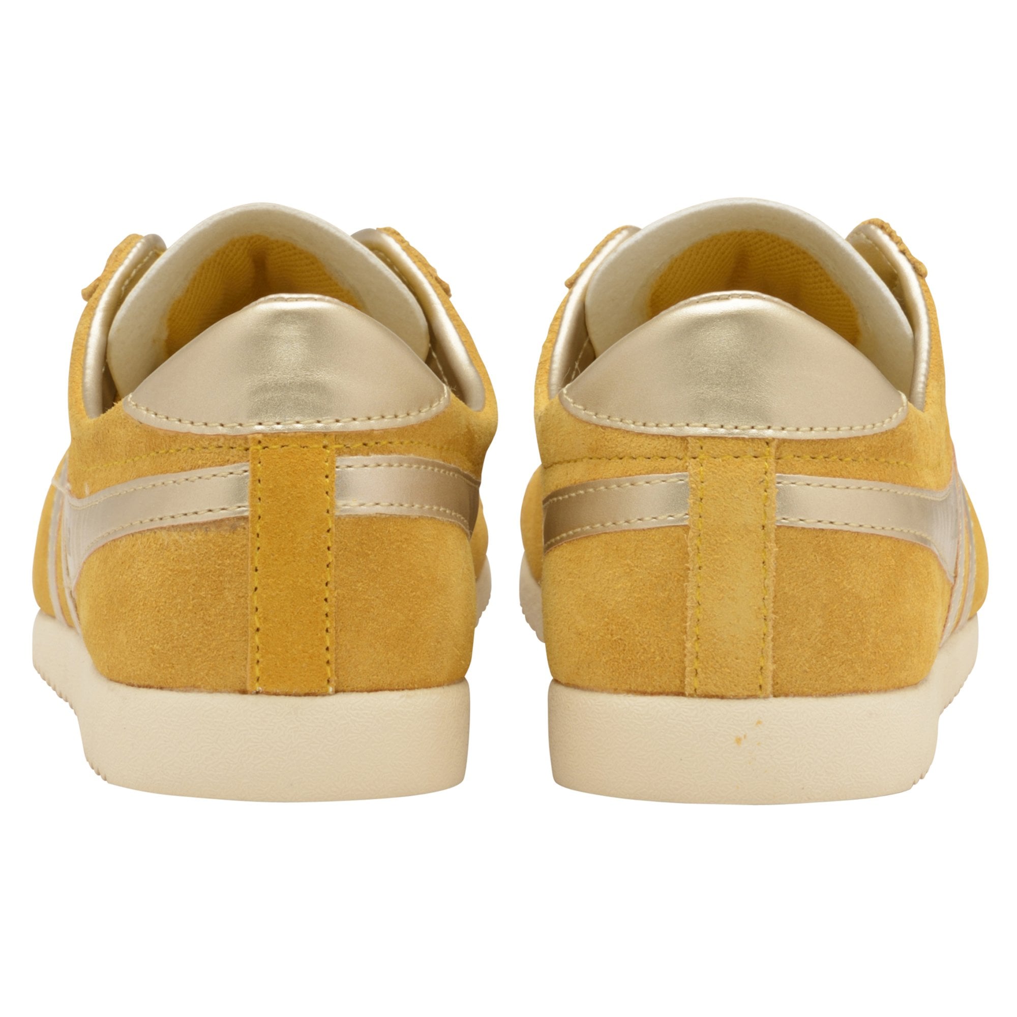 Rear view of two mustard yellow Gola trainers, highlighting the gold heel accents.