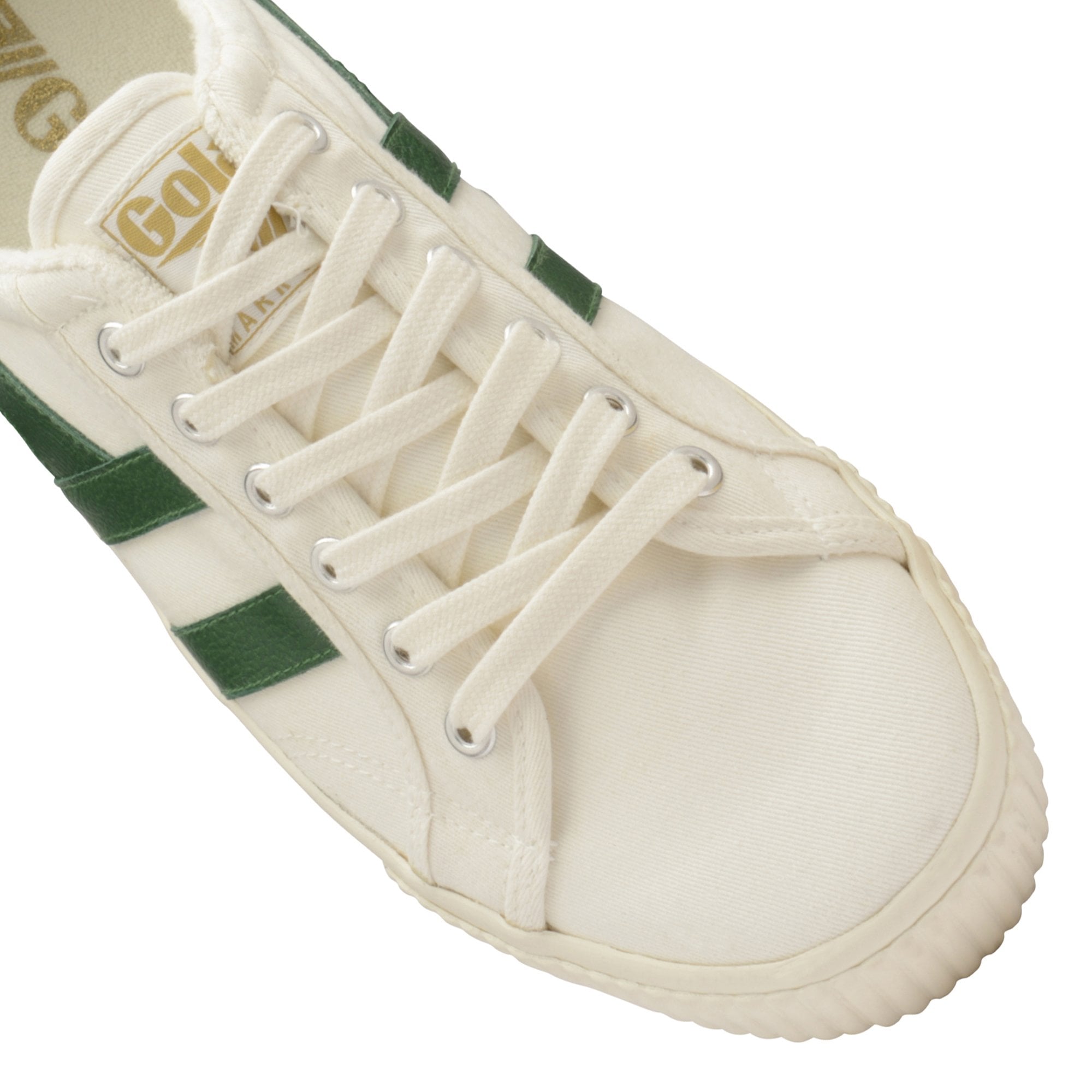 Close-up of the front of a white canvas Gola women's trainer.