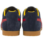 A pair of men's Gola Harrier sneakers in navy with red stripes and yellow trim. Back view.
