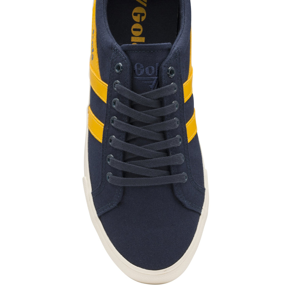 A top-down view of a blue and yellow Gola sneaker, highlighting the laces.