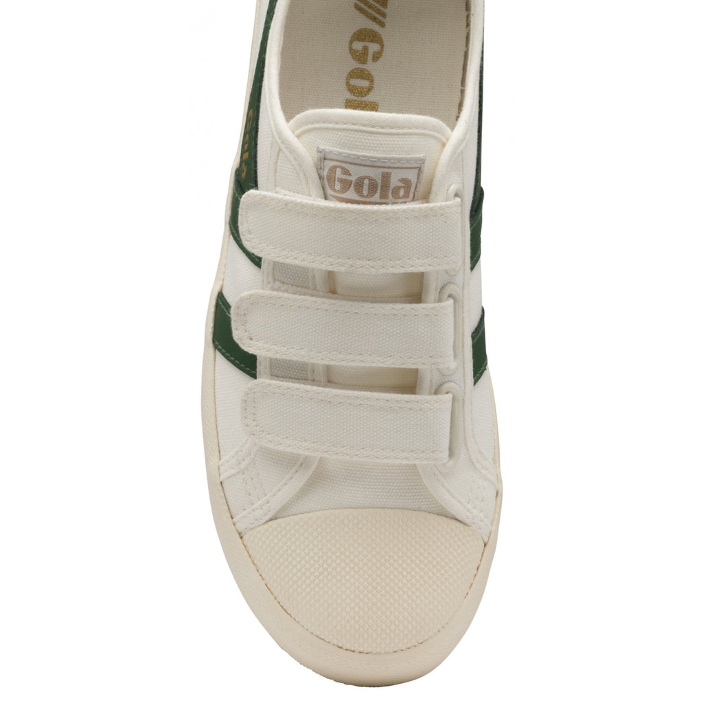 Top-down view of a white Gola sneaker with green stripes and three white hook-and-loop straps.