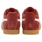 The back view of a pair of red Gola sneakers with white stripes and gum soles.