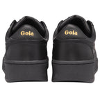 The back of two black Gola trainers, showing gold Gola logo on the heel.