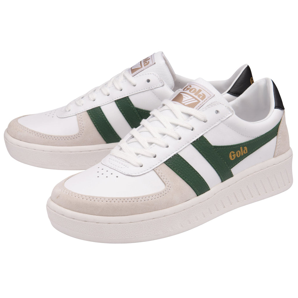 A pair of Gola women's white, green, and tan low-top sneakers with black heels.