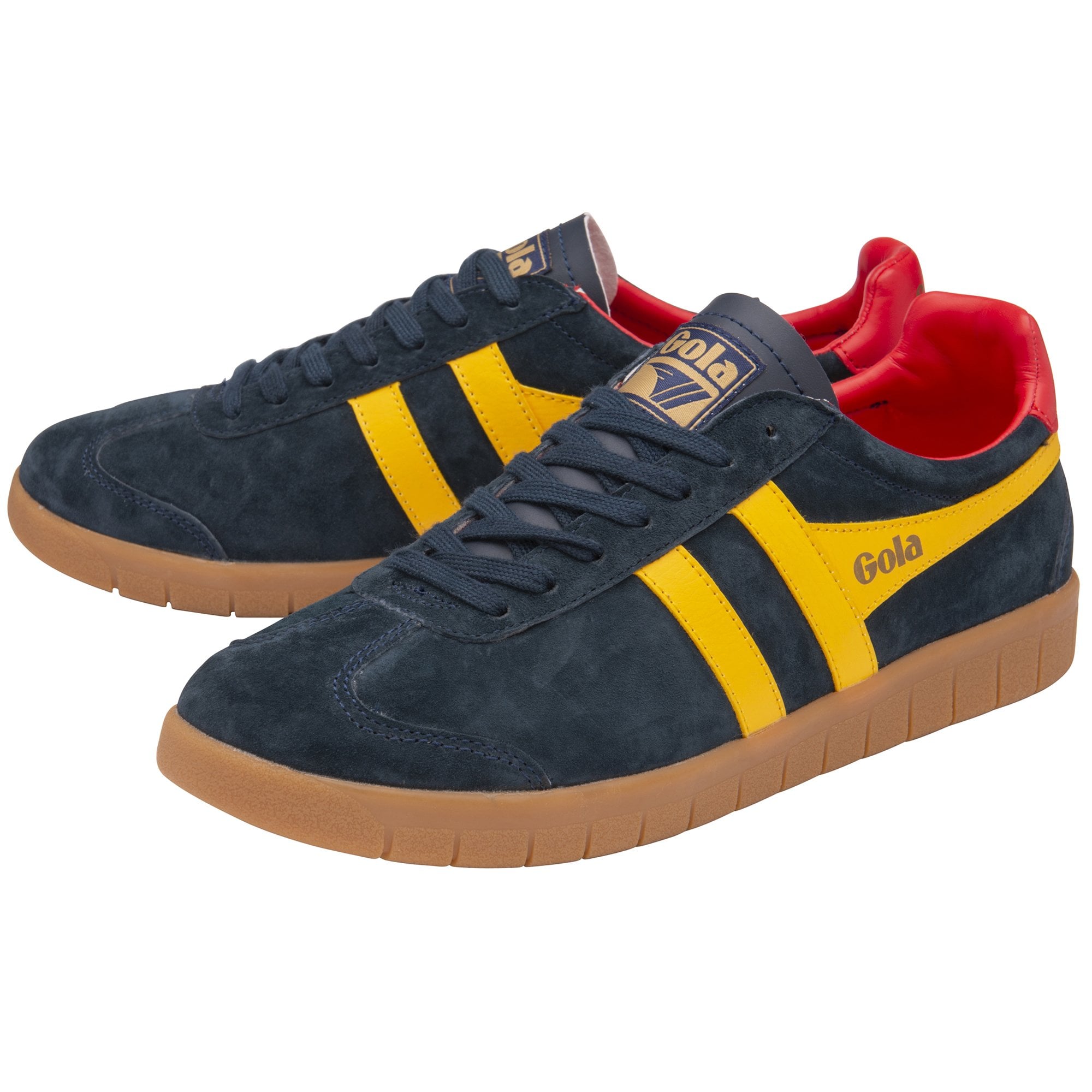 A pair of navy Gola low-top sneakers with yellow stripes and red detailing.