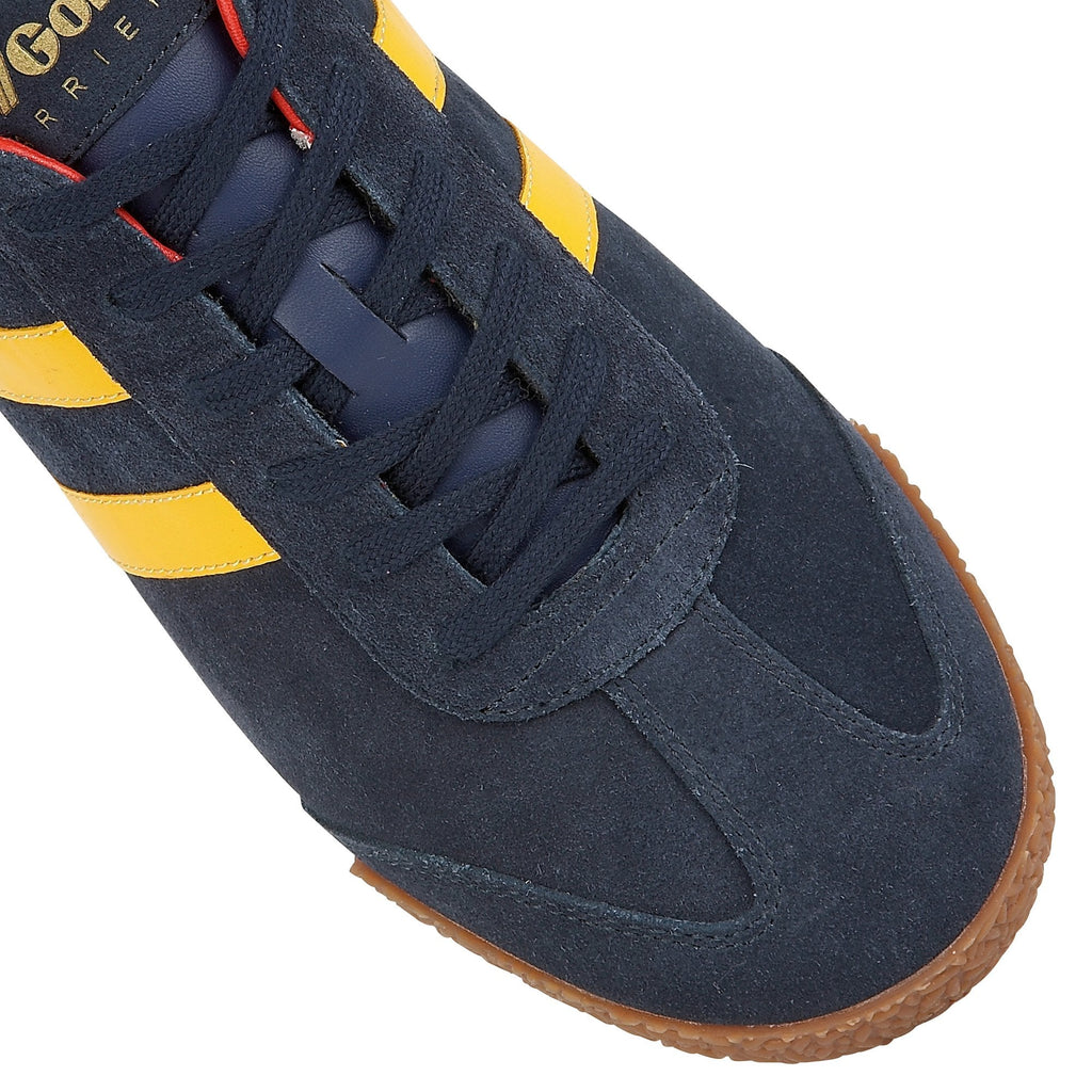 Close-up of the toe and laces of a Gola Harrier suede trainer in navy with yellow stripes.