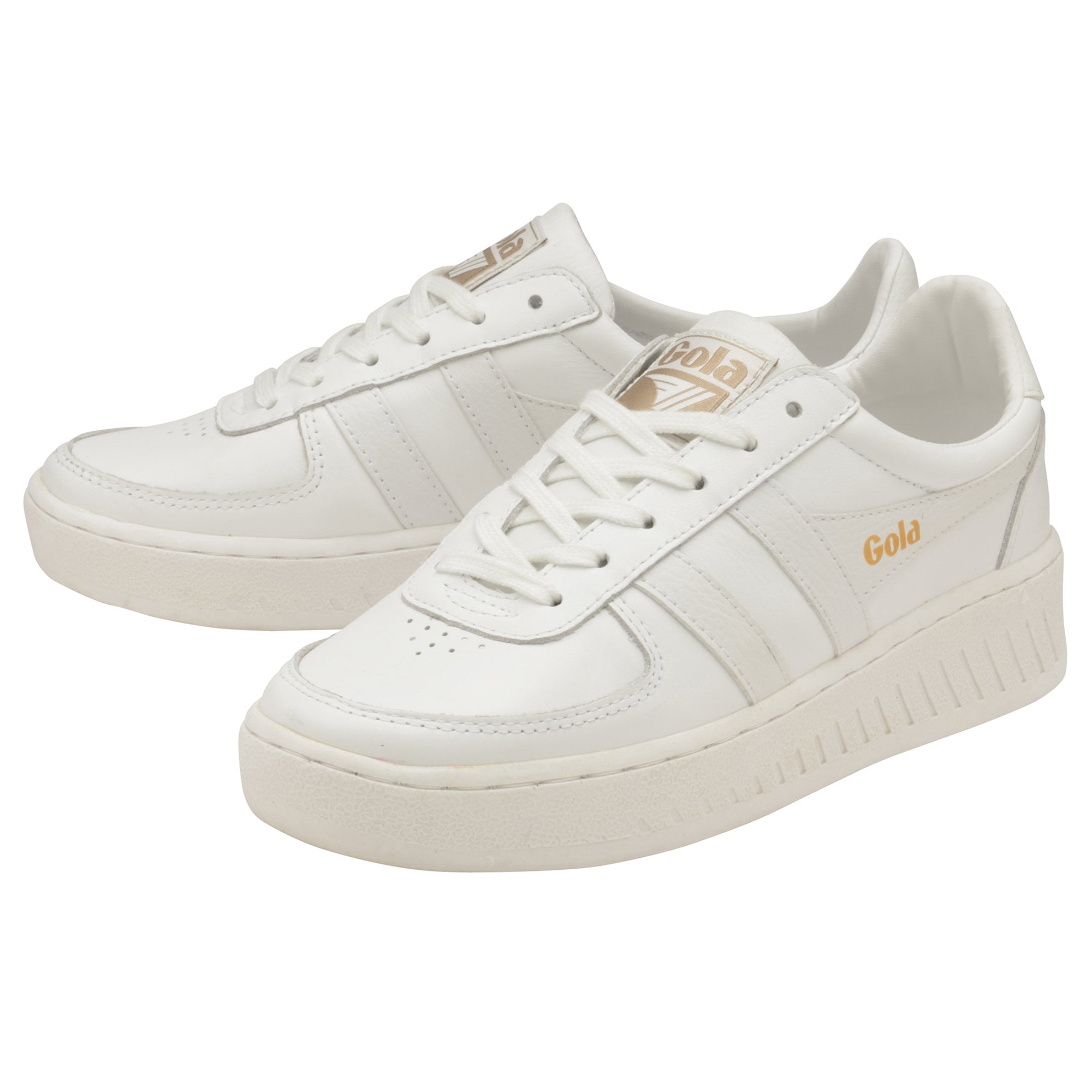 Pair of white Gola sneakers with gold branding, angled on a white background.