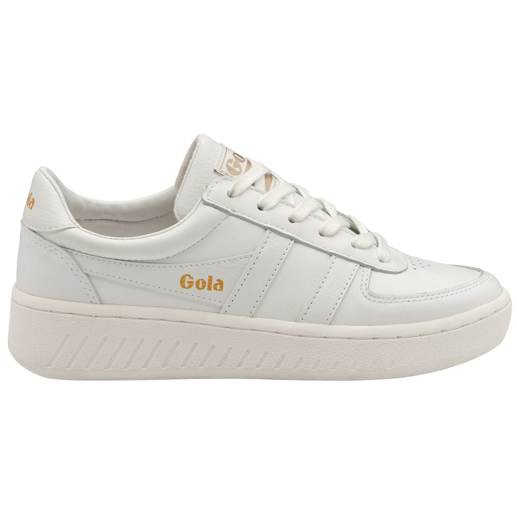 Side profile of a white Gola sneaker with gold branding on a white background.
