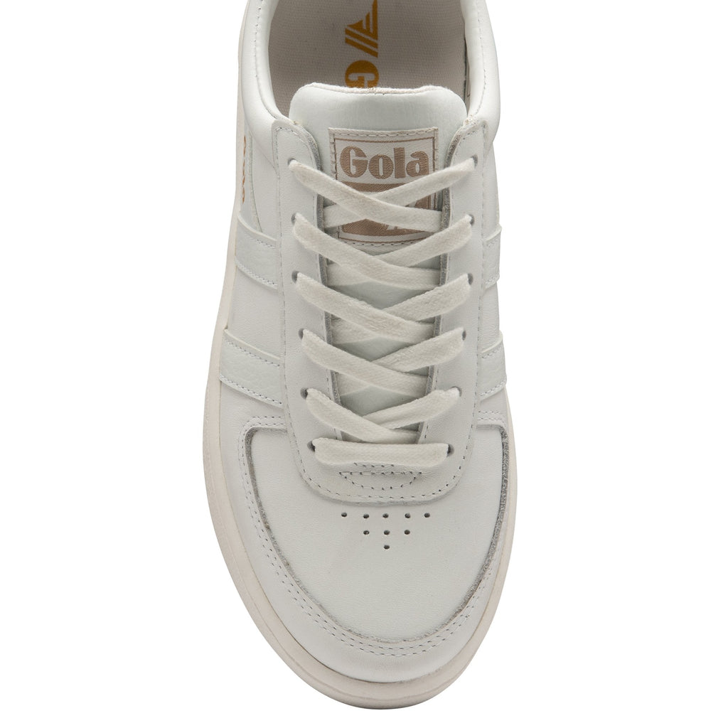 Top-down view of a white Gola sneaker with gold branding on a white background.