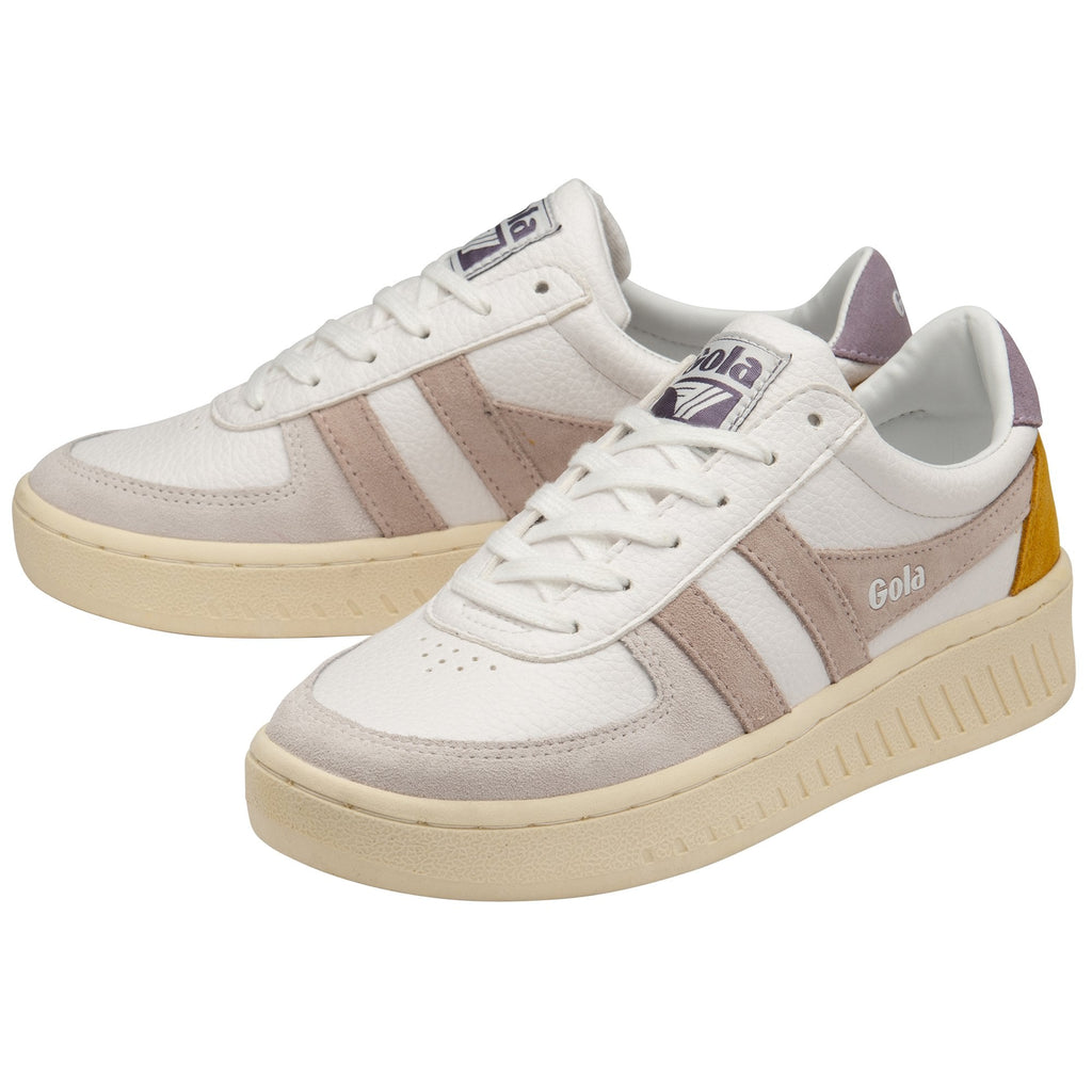 A pair of white Gola women's sneakers with peach stripes and yellow heels.