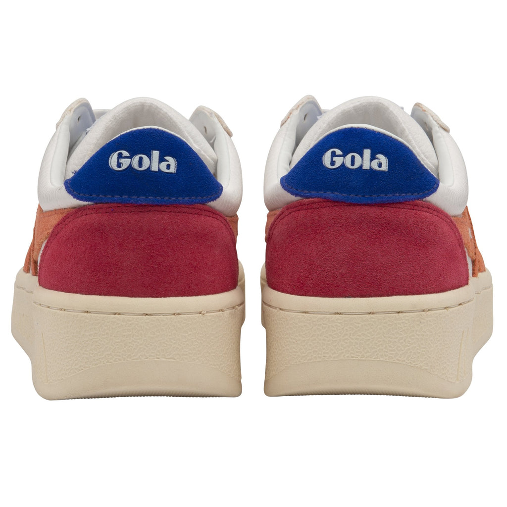 The back view of a pair of white Gola sneakers with red heels and blue Gola logos.