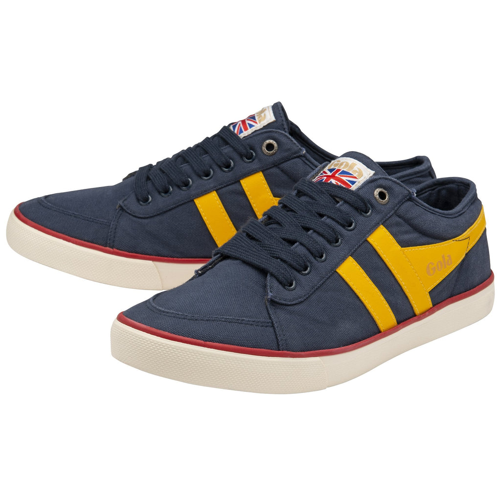 A pair of navy and yellow Gola sneakers on a white background.
