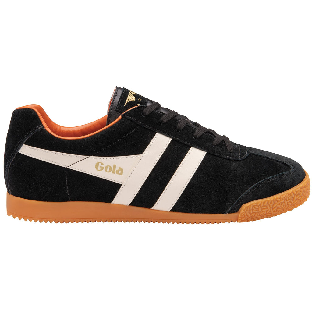 A black Gola Harrier shoe with white stripes and an orange sole on a white background.