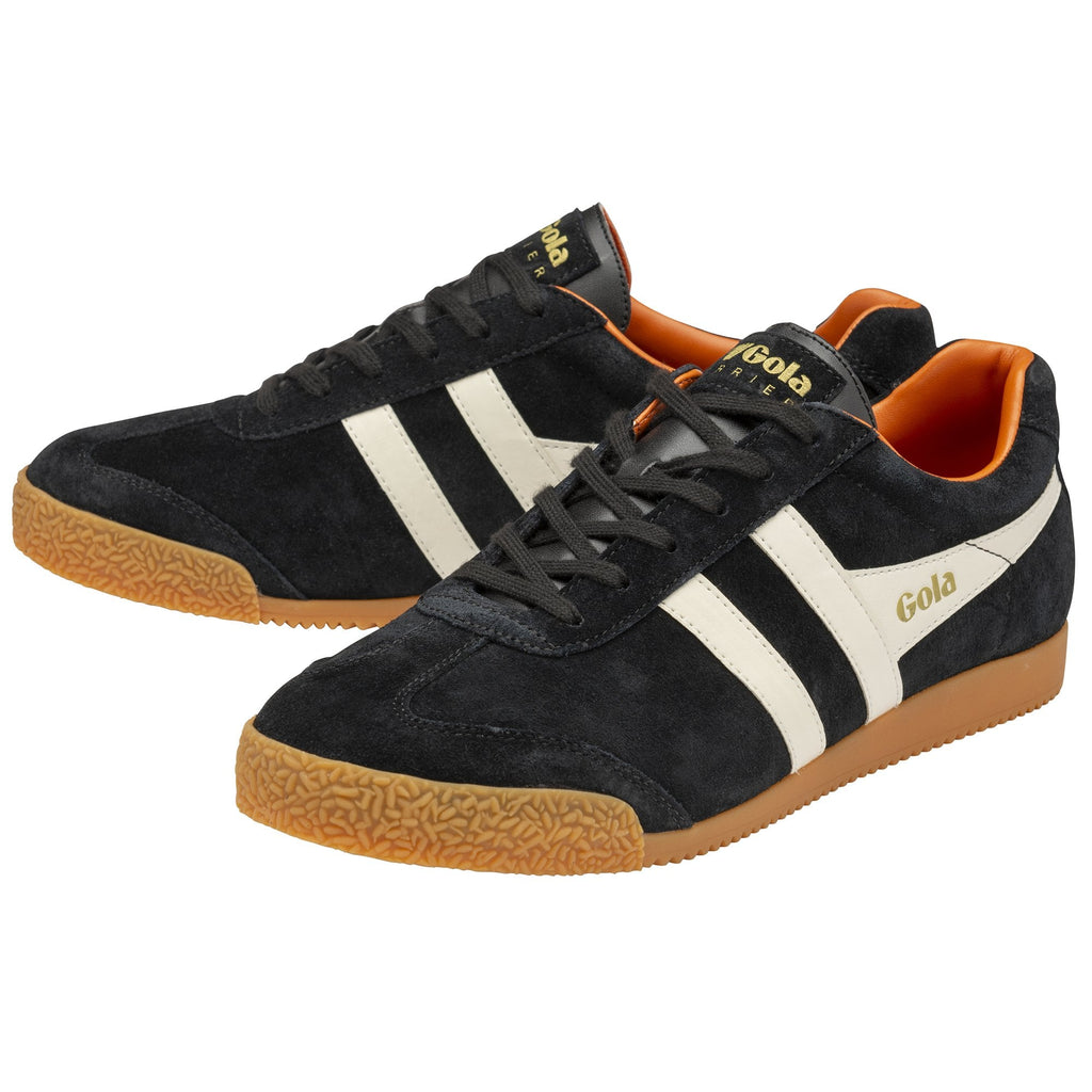 A pair of black Gola Harrier shoes with white stripes and orange soles.