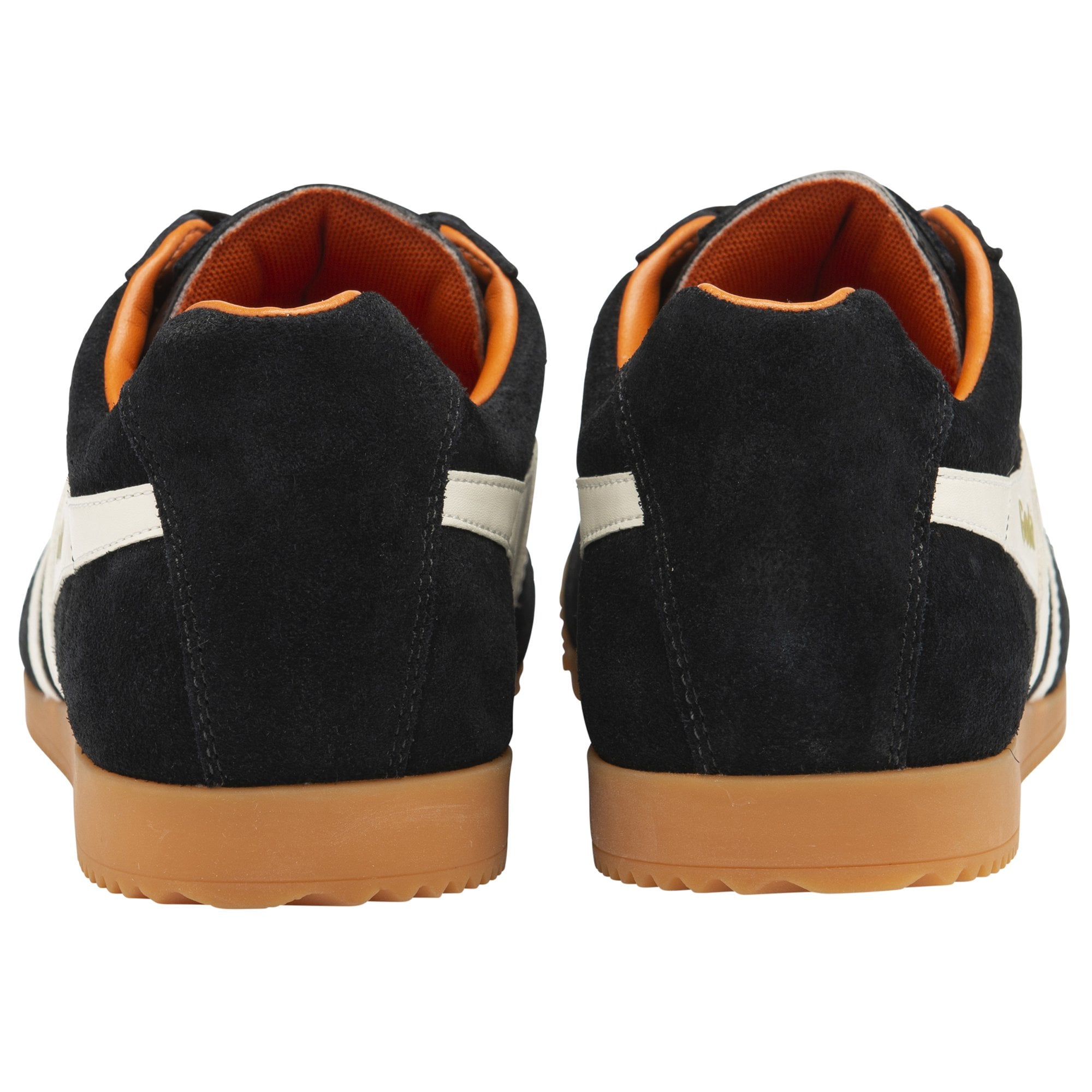 The rear view of a pair of black Gola Harrier shoes with white stripes.