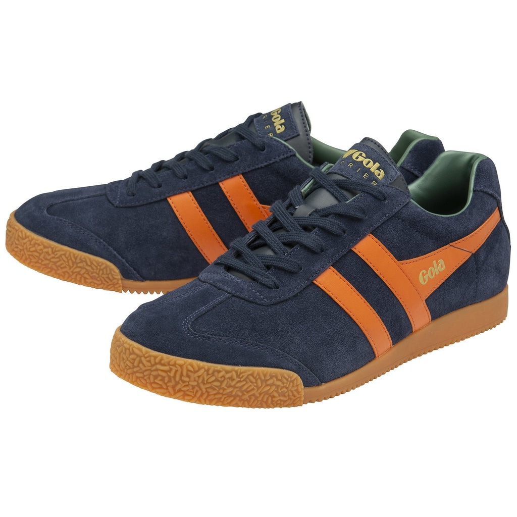 A pair of navy blue Gola trainers with orange stripes.
