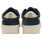 The back view of a pair of Gola women's low-top navy and gold sneakers.