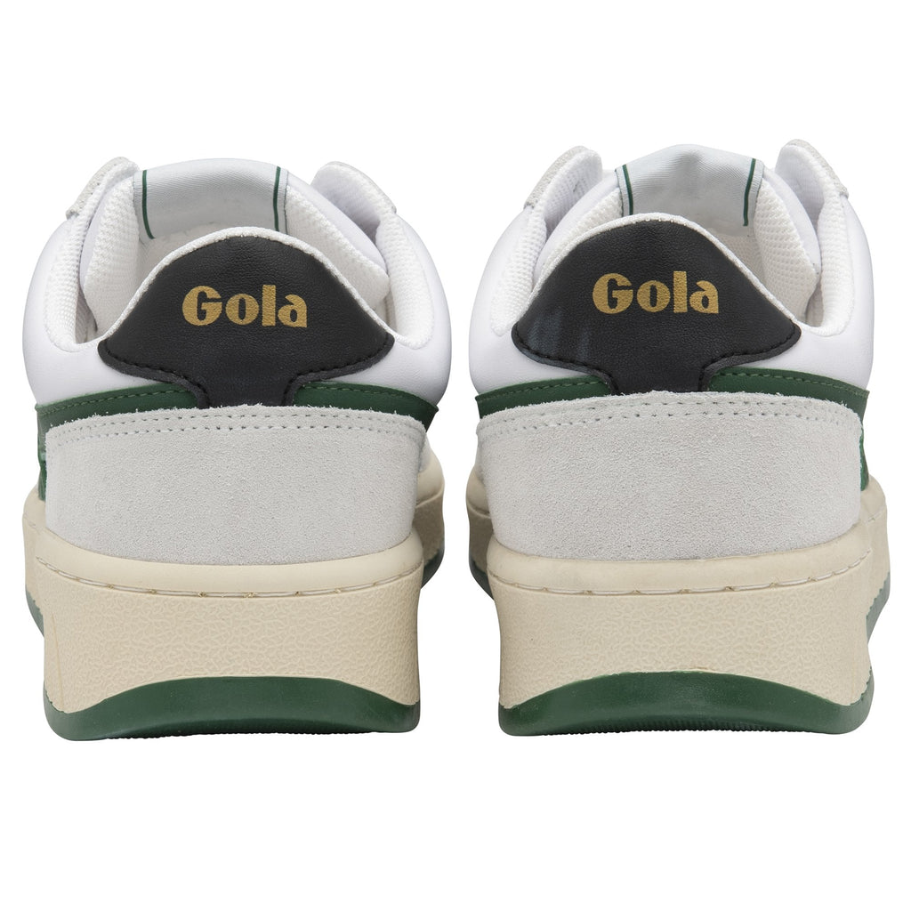 A pair of white and green Gola sneakers from behind.
