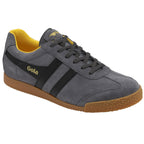 A single gray suede Gola sneaker with black stripes and a yellow interior, angled slightly.