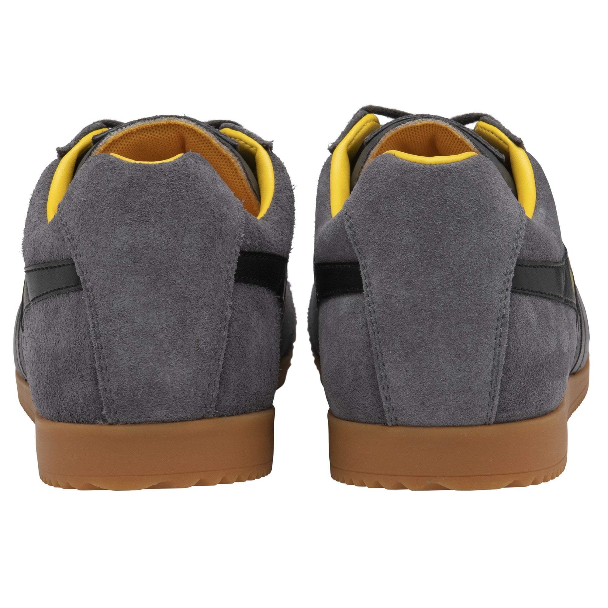 The rear view of two gray suede Gola sneakers with yellow interiors and brown soles.