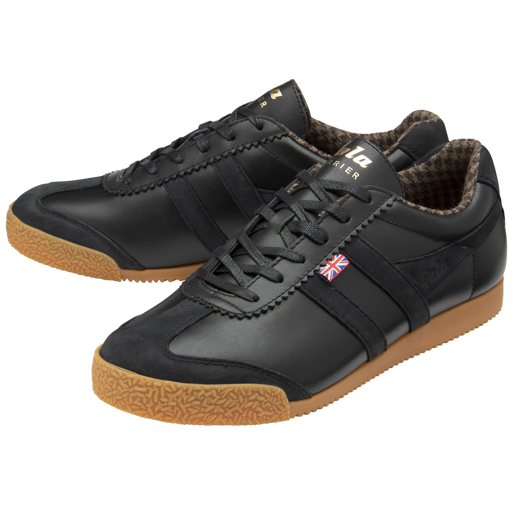 Two black sneakers with brown soles, angled together.