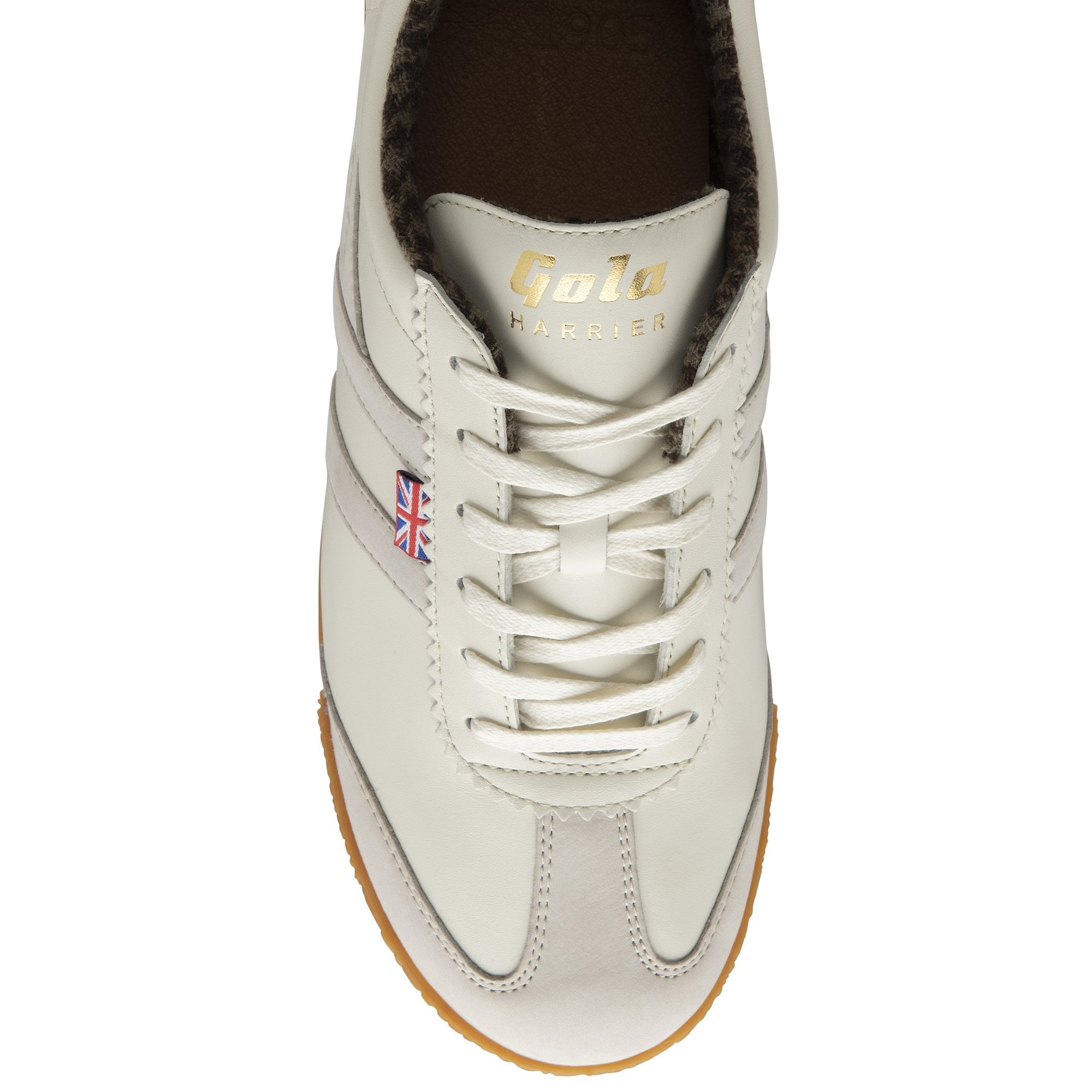 The top-down view of a single off-white sneaker with light grey stripes and gum sole.