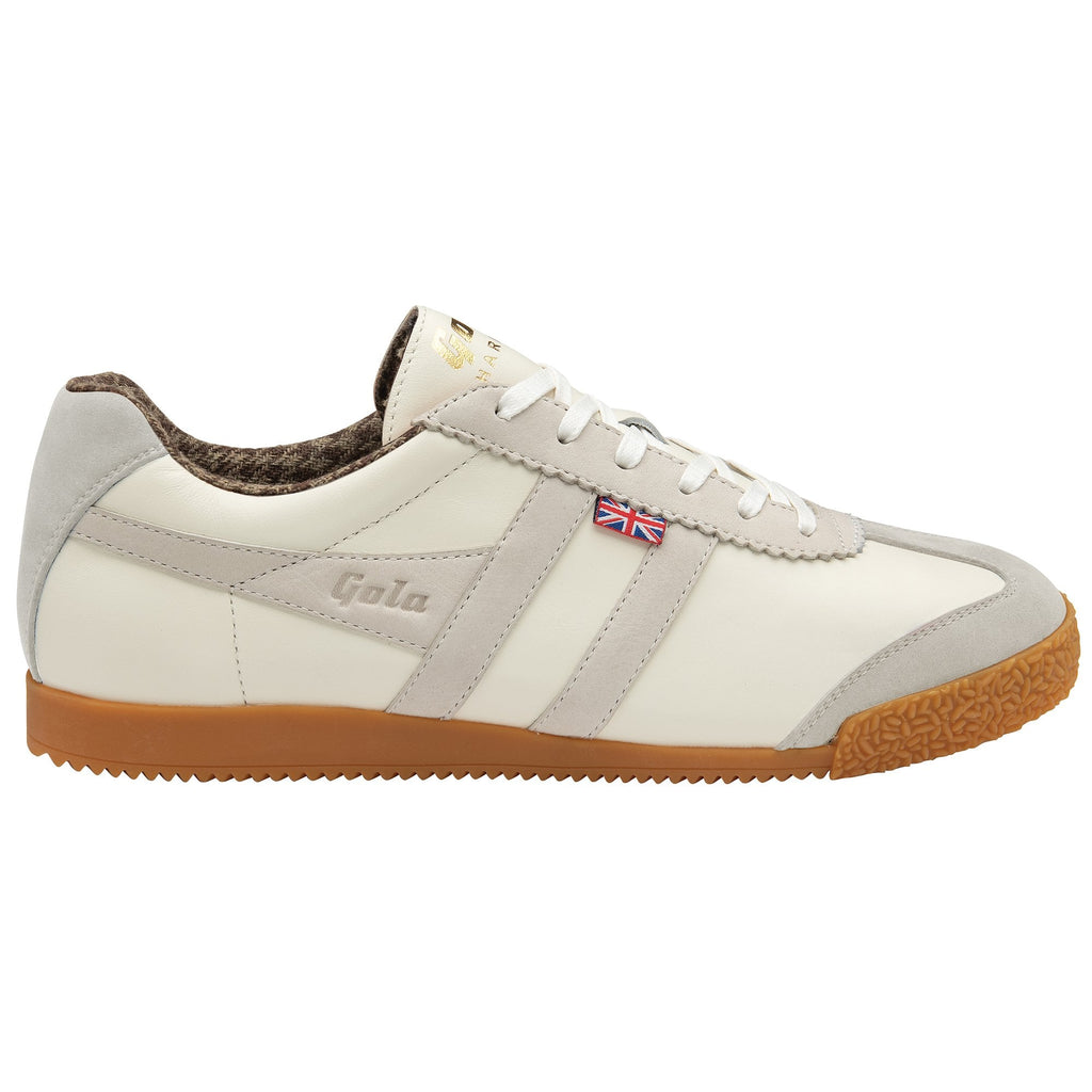 A single off-white sneaker with light grey stripes and gum sole, viewed from the side.