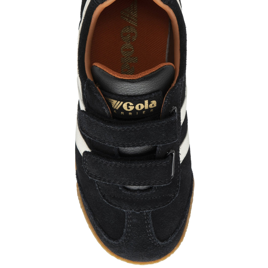 Black and white Gola trainer with Velcro straps and brown sole, top down view.
