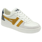 A single white Gola sneaker with gold stripes, from a slight angle.