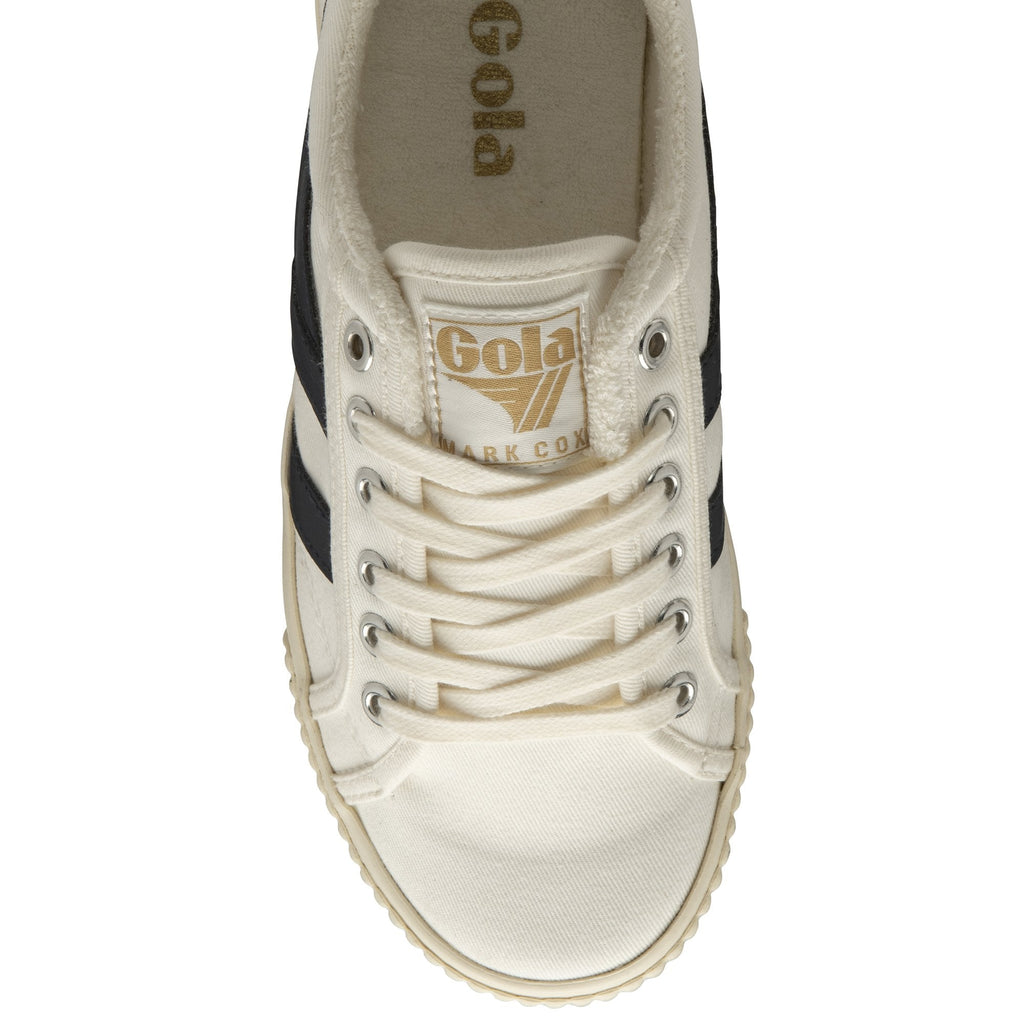 Top-down view of a white Gola women's trainer with black stripes and a cream sole.