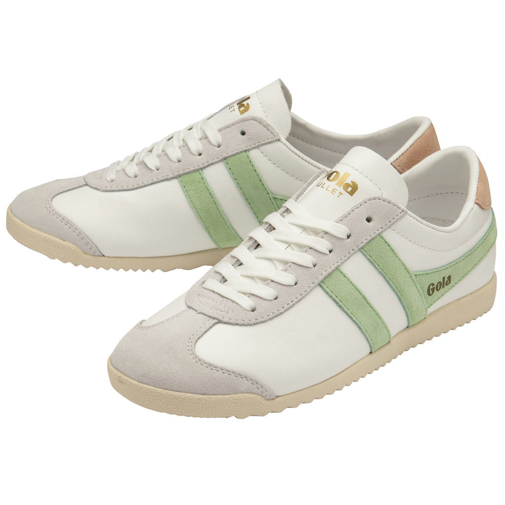 Pair of white Gola sneakers with green stripes, tan heel tabs, and light grey accents.