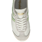 Top-down view of a white Gola sneaker with green stripes and white laces.