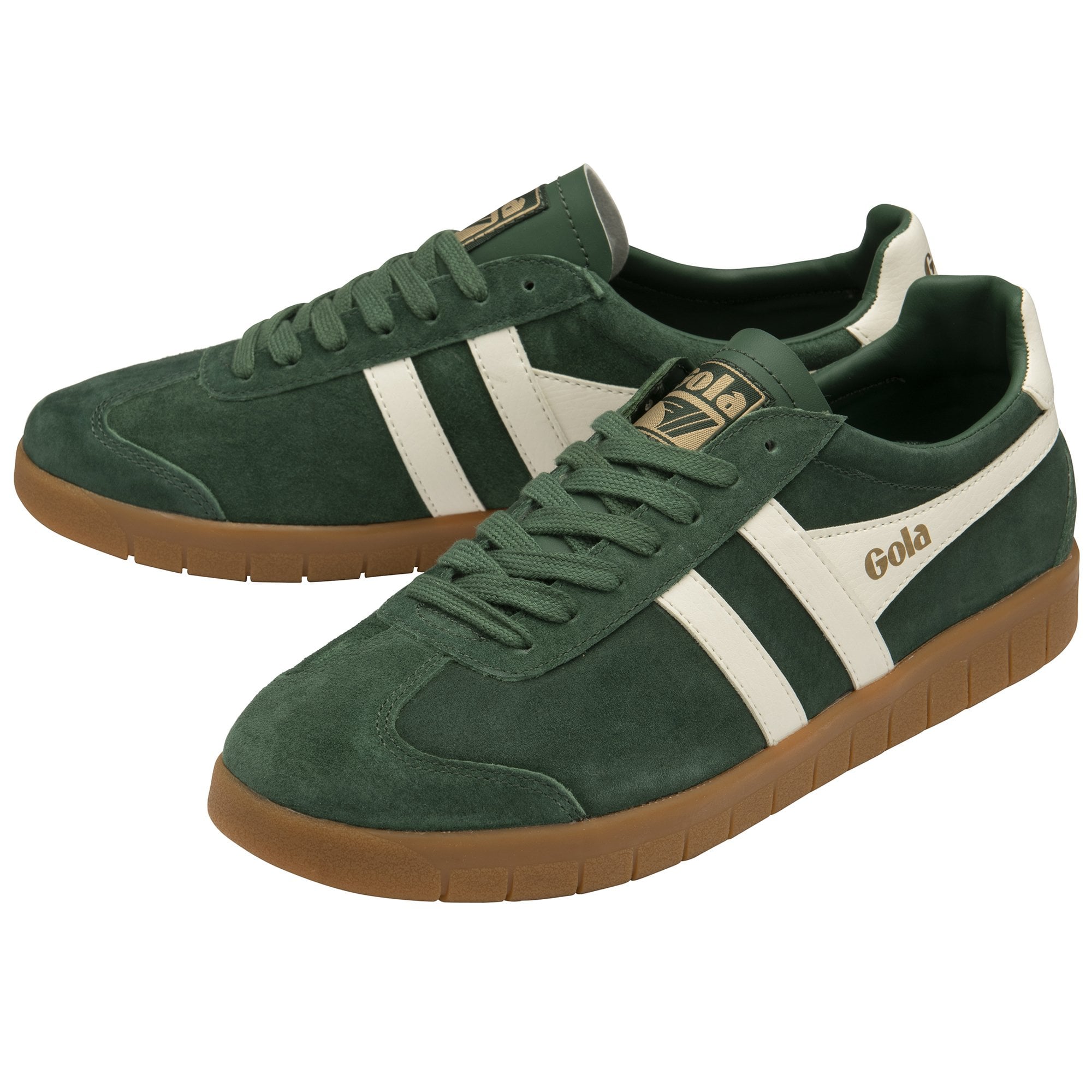A pair of dark green Gola low-top sneakers with white stripes and tan gum soles.