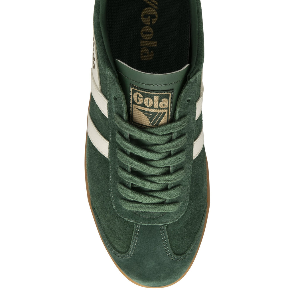 An overhead view of a dark green Gola low-top sneaker with white stripes and a tan sole.