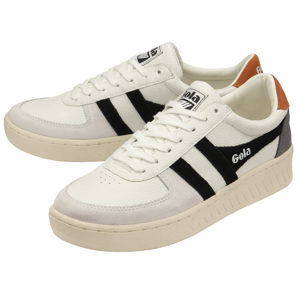 A pair of white Gola sneakers with black stripes and tan heel tabs, angled together.