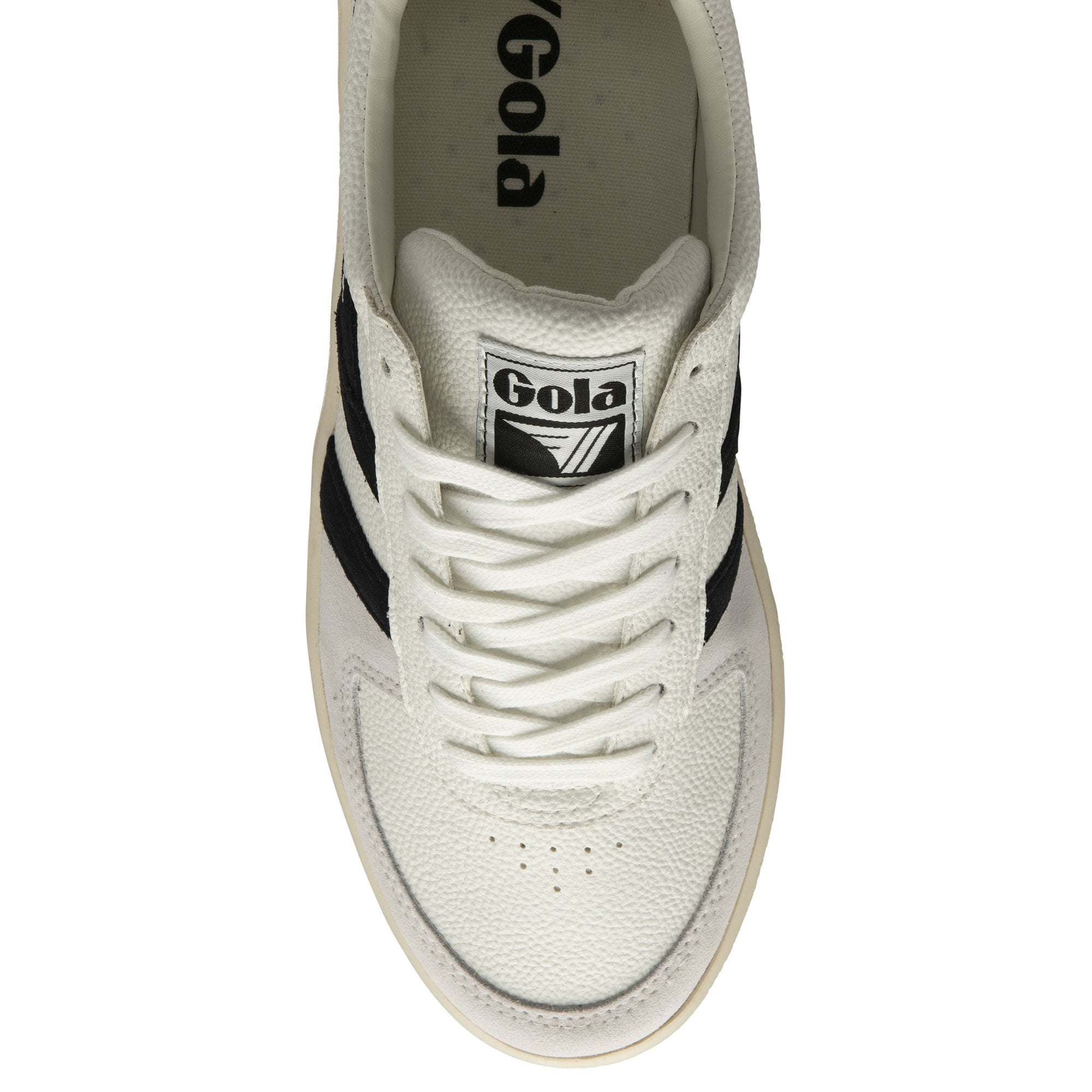 The top-down view of a white Gola sneaker with black stripes and white laces.