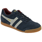 A single Gola Harrier trainer in navy blue suede with white stripes and a gum sole, angled view.