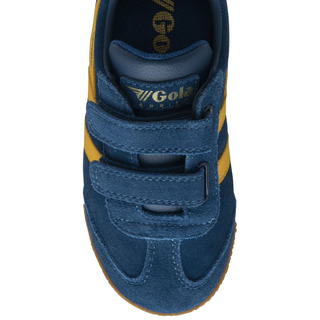 Top-down view of a blue suede Gola sneaker with yellow stripes and velcro straps.