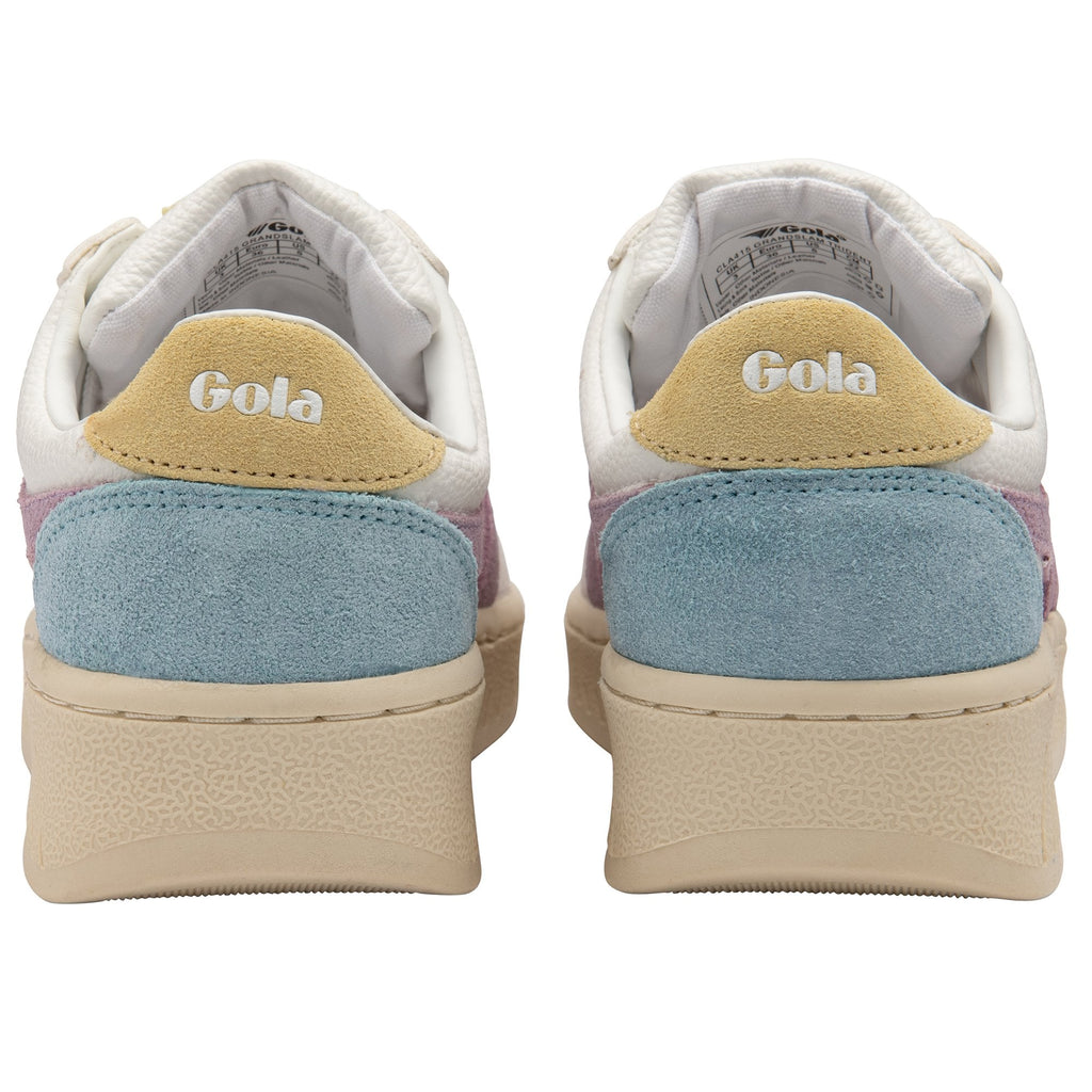 The back view of two white Gola sneakers with blue and yellow accents.