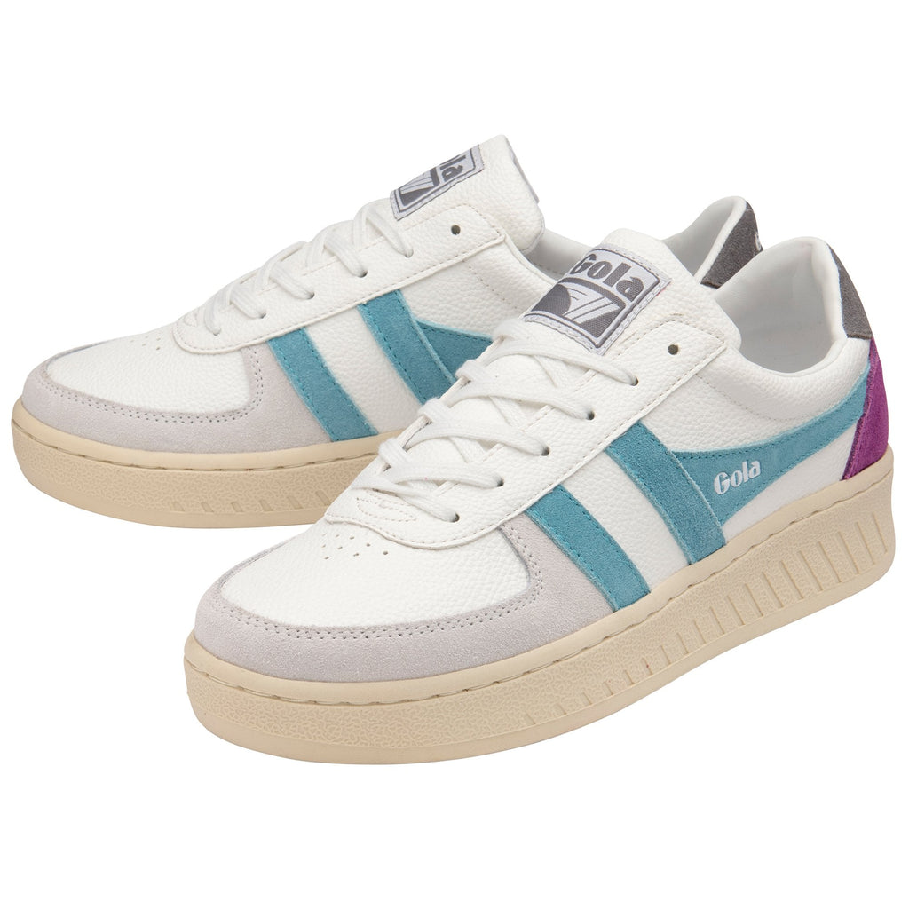 Pair of white Gola sneakers with teal and purple accents, angled for full view.