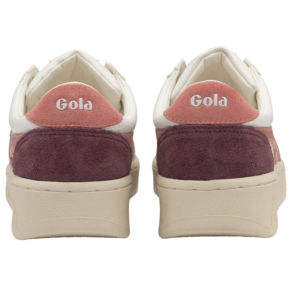 The back view of two white, pink, and burgundy Gola sneakers.
