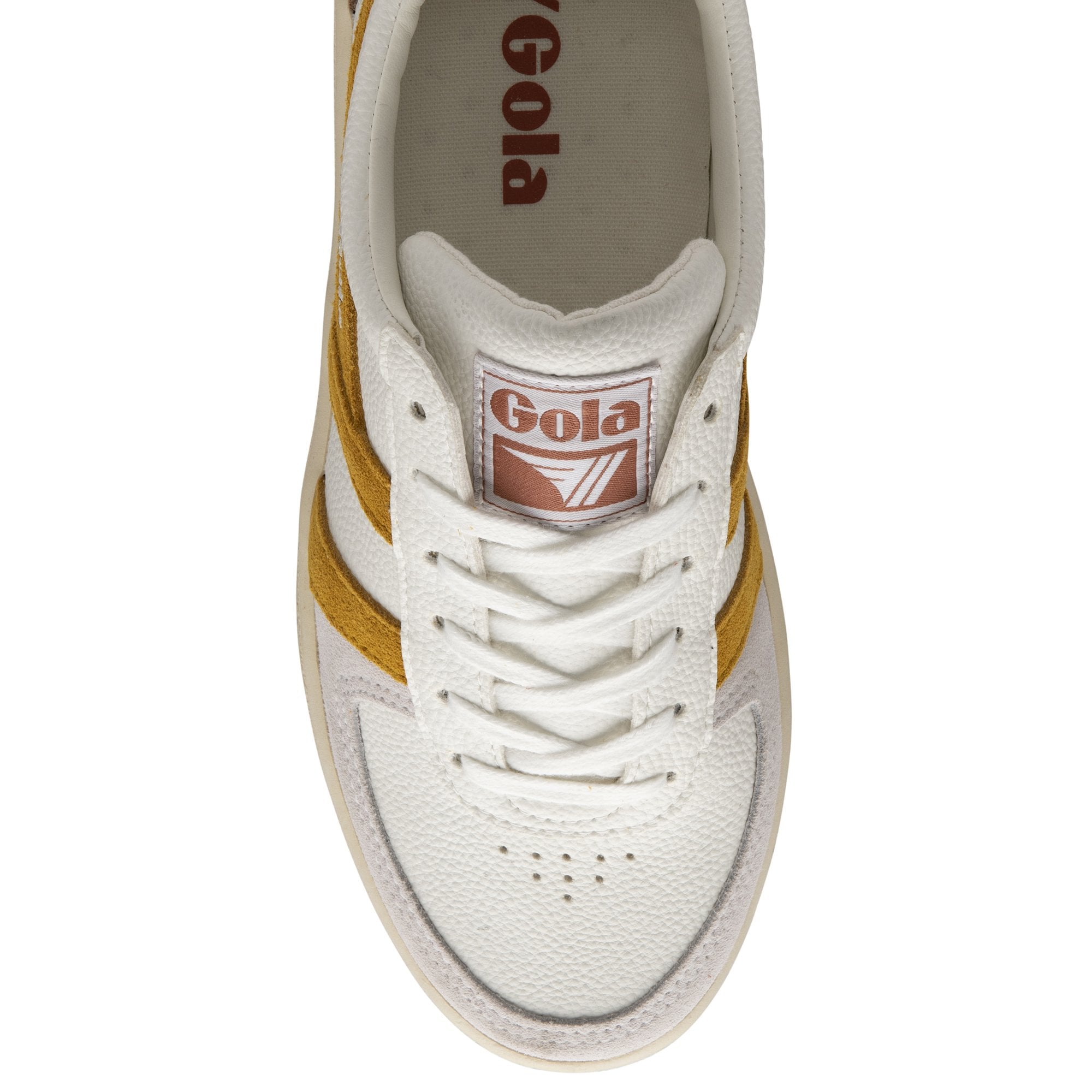 Top-down view of a single Gola sneaker with white laces and mustard stripes.