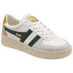 A white Gola shoe with a green stripe and a gold heel.