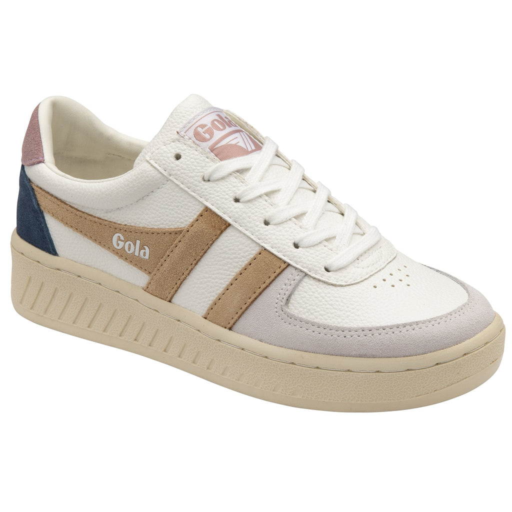 A white Gola sneaker with tan, navy, and pink accents on a white background.