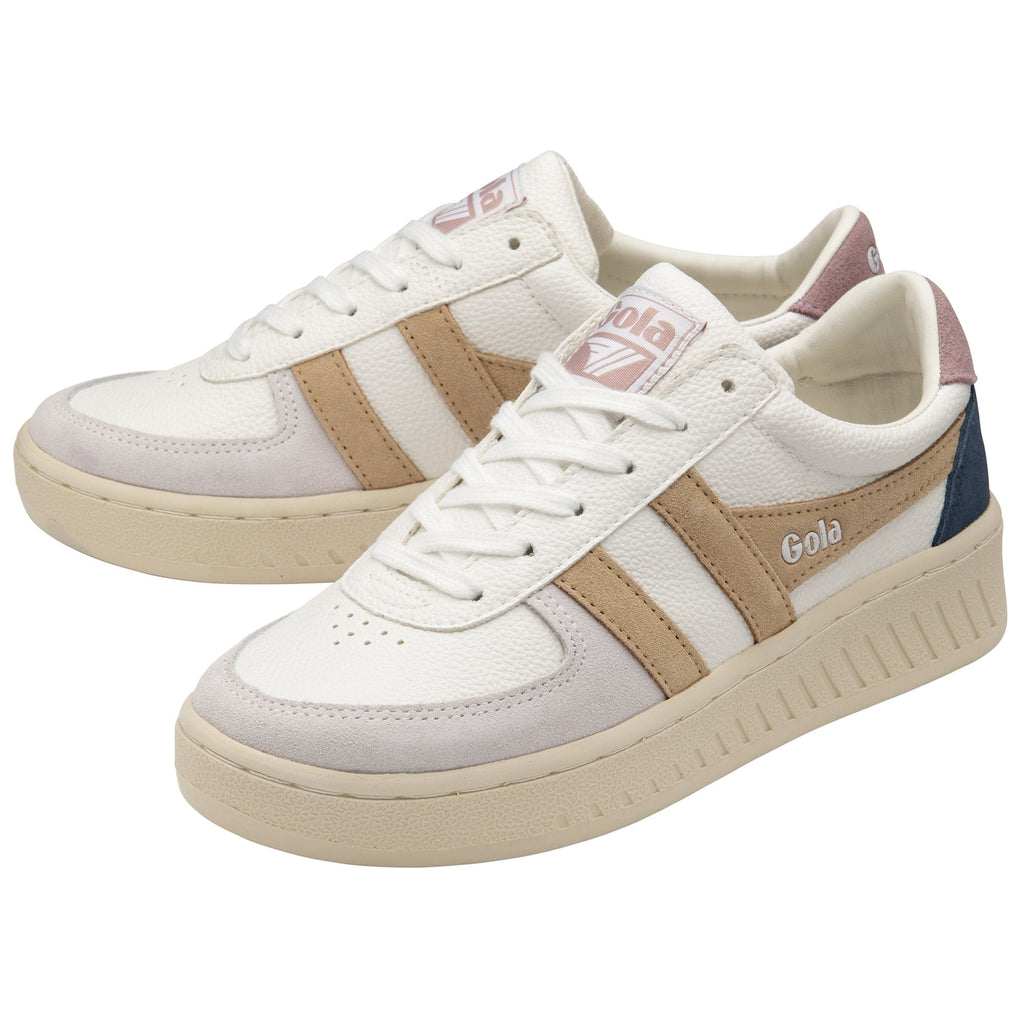 A pair of white Gola sneakers with tan, navy, and pink accents.